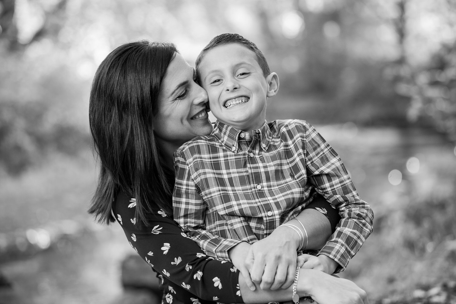 Mother hugs son and laughs with him for family portraits in Erie, PA