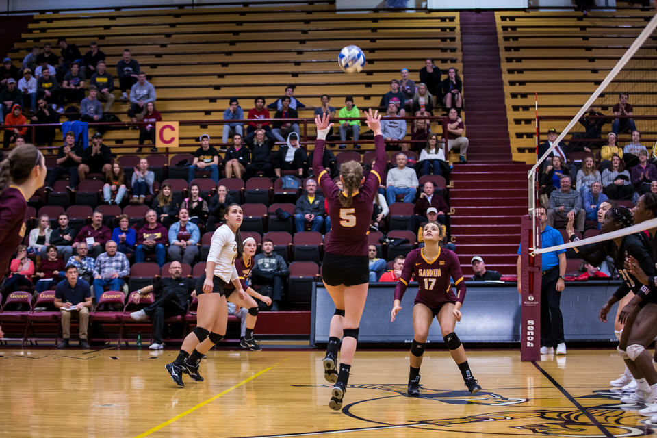 Gannon University's women's volleyball player sets the ball