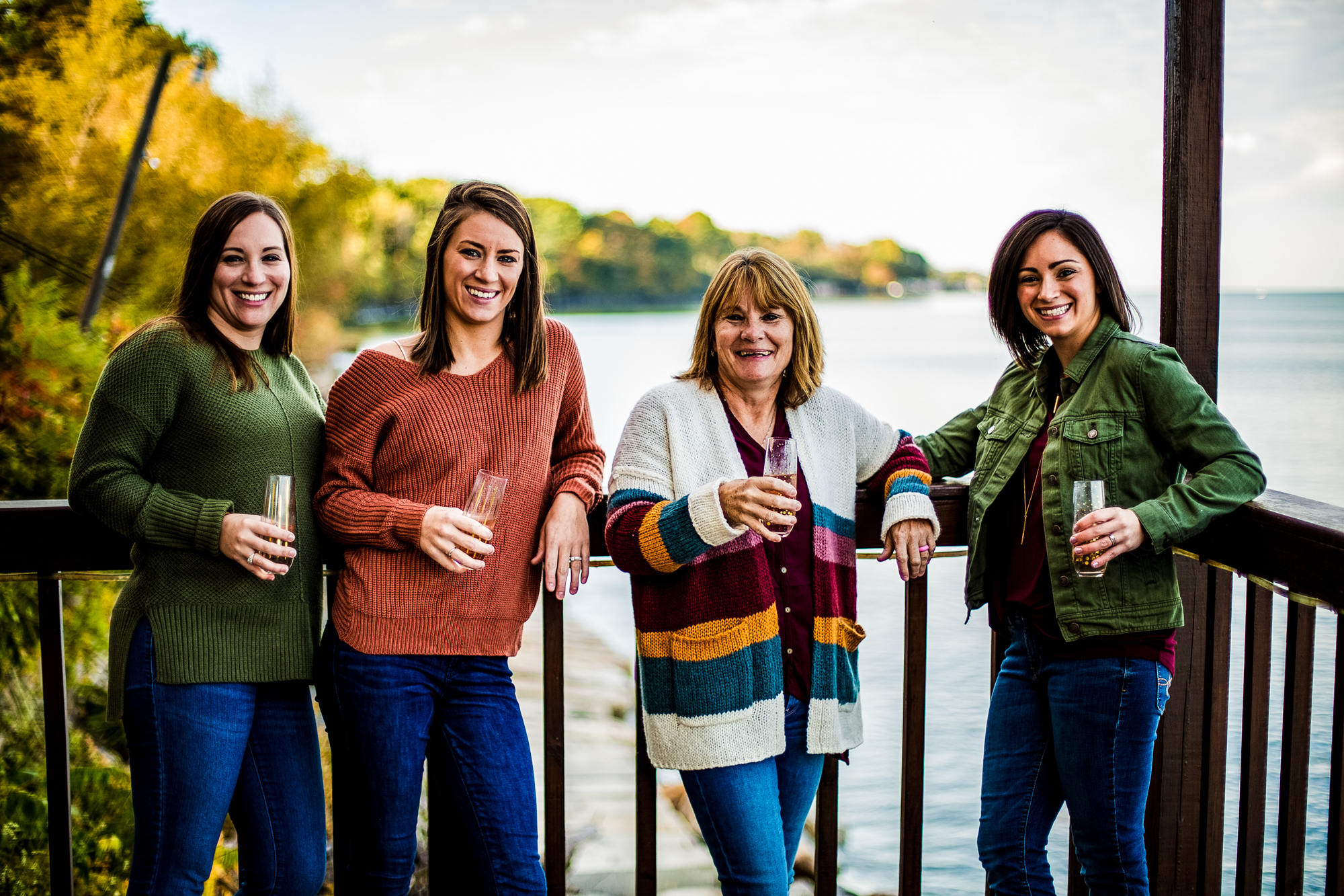 Women standing on a deck drinking champagne in North East, PA